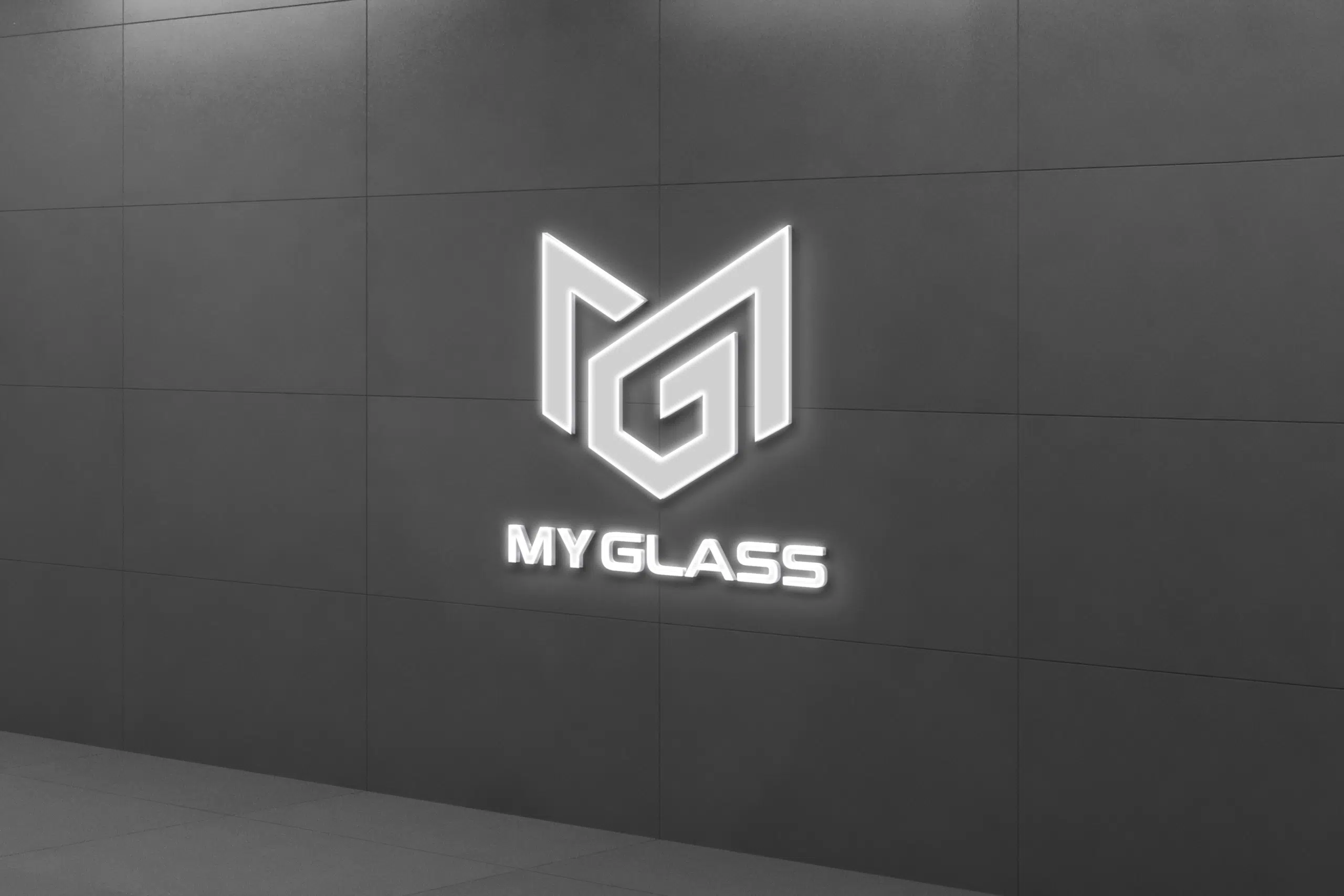 Réception de MyGlass avec logo en relief sur un mur noir, reflétant l'élégance et l'innovation de l'entreprise spécialisée en réparations parebrise.